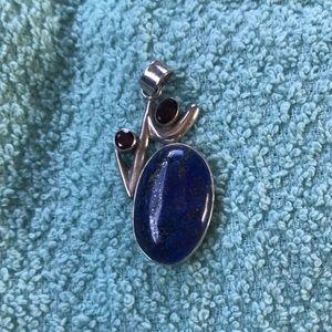 Beautiful blue stone with 2 red accent stones.